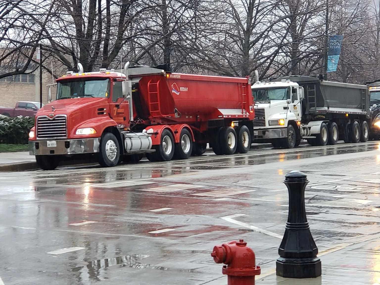 Trim's Trucking trucks in wet Chicago conditions